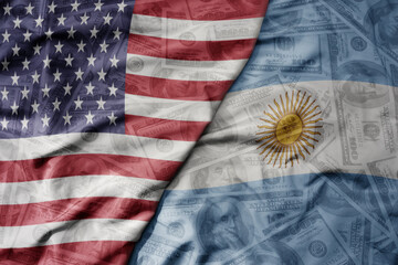 big waving colorful flag of united states of america and national flag of argentina on the dollar money background. finance concept.