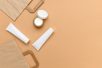 Cosmetic cream in white plastic containers. Craft bags.