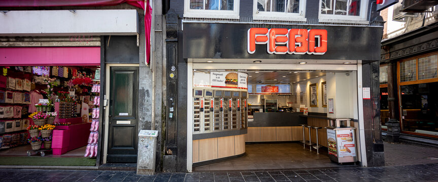 Fast food out of the wall. Febo snackbar junkfood with heated walls to take away instantly next to tourist souvenir shop.