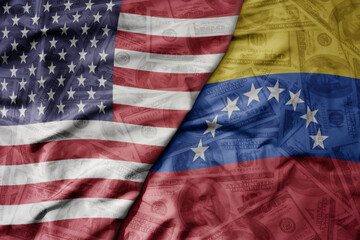 big waving colorful flag of united states of america and national flag of venezuela on the dollar money background. finance concept.