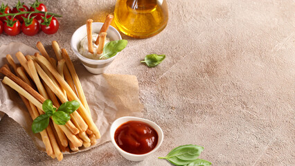 Grissini breadsticks with sauces for appetizers
