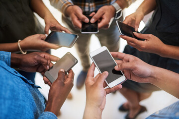 Phone, hands and group of friends in circle networking online for email, social media or internet. Technology, typing and team of people with cellphone screen for text message on website from above.