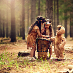 Native American children, drum and music in nature with playing, bonding and connection in woods....