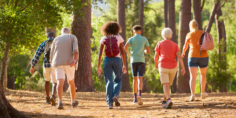 Rear View Of Active Three Generation Family On Outdoor Hike In Countryside Together