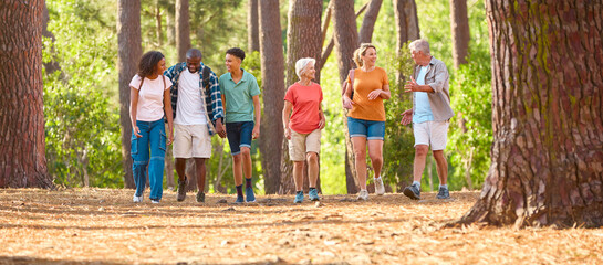 Active Three Generation Family On Outdoor Hike In Countryside Together