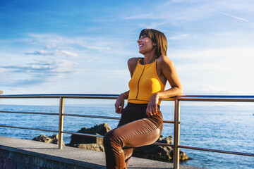 Joyful Woman Smiling by the Seaside