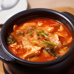 generated illustration pot of  kimchi soup with soft tofu or Korean kimchi stew