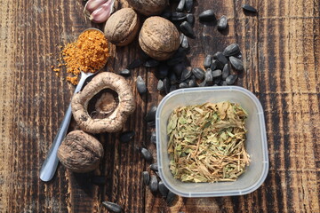 Composition with walnuts and seeds on wooden background, top view