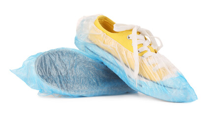 Sneakers in blue shoe covers isolated on white