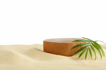 Presentation of product. Wooden podium and palm Leaf on sand against white background
