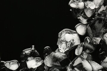 Pieces of crushed ice on black background