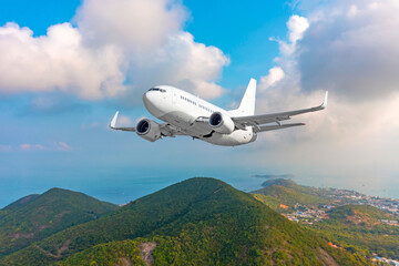 Passenger jet plane flying over beautiful island blue ocean in purity destination sea beach use for...