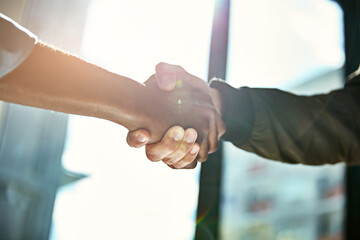 Partners, handshake and teamwork for meeting in office, cooperation and contract deal or...