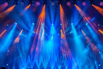 The image captures a dynamic view of the stage with vibrant lights during a live concert,...