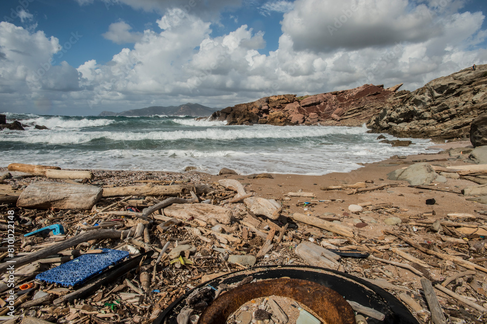 Wall mural beach and sea, rubbish on the beach cala viola, porto ferro, porticciolo., alghero, sardinia, italy