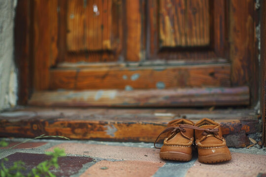 The image of a childs small shoes at the doorstep, a reminder of the innocence that deserves protection and care 