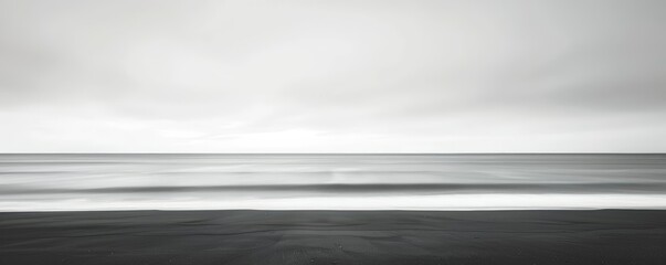 minimalist coastal landscape with negative space featuring a small wave and gray sky