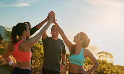 Friends, group and high five or outdoor exercise on mountain for trail running, support or fitness....