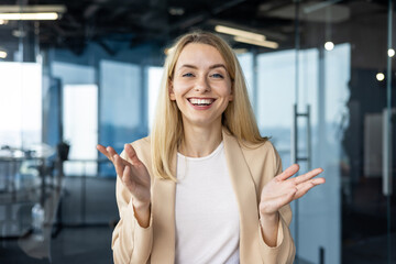 Professional woman talking and gesturing in modern office