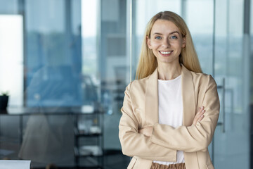 Fototapeta premium Confident businesswoman smiling in modern office environment