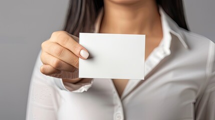 The Power of Connection: Woman Holding a Business Card