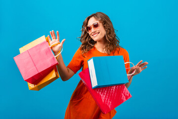 attractive happy smiling stylish woman holding shopping bags