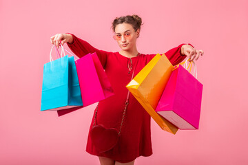 attractive happy smiling stylish woman holding shopping bags