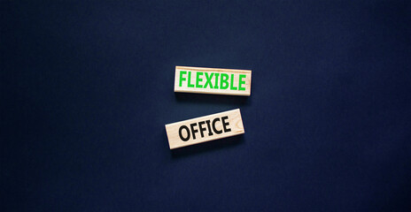 Flexible office symbol. Concept words Flexible office on beautiful wooden block. Beautiful black paper background. Business Flexible office concept. Copy space.