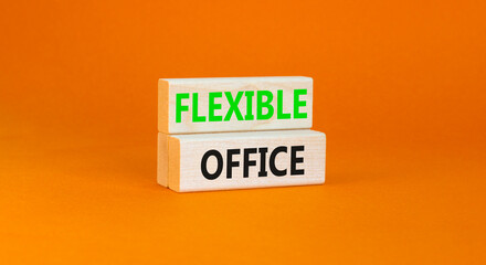 Flexible office symbol. Concept words Flexible office on beautiful wooden block. Beautiful orange paper background. Business Flexible office concept. Copy space.