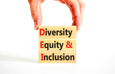 DEI diversity equity and inclusion symbol. Concept words DEI diversity equity and inclusion on blocks. Beautiful white background. Business DEI diversity equity and inclusion concept. Copy space.