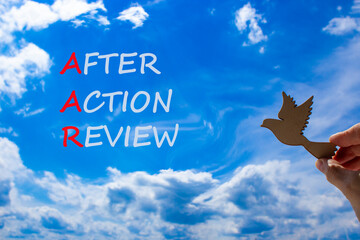 AAR After action review symbol. Concept words AAR After action review on beautiful blue sky clouds...