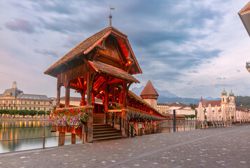 Chapel Bridge, Kapellbrucke over the river Reuss during evening blue hour in Old Town of Lucerne, Switzerland