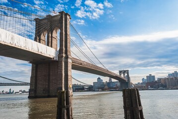 The Brooklyn Bridge is a large suspension bridge that spans the East River