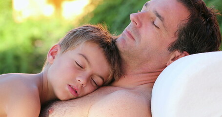 Fototapeta premium Young boy asleep on father chest authentic real life candid family moment