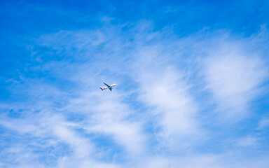 flying airplane on blue sky 