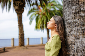 Young Hispanic Woman Breathing Fresh Air Outdoors