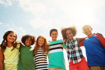 Children, friends and portrait as group in sunshine for school trip or bonding, diversity or...