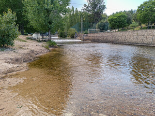 Water of the Alviela river and two weirs from its source on Olhos d'Água beach, Alcanena PORTUGAL