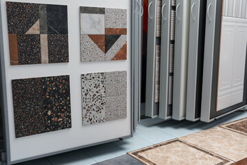 Samples of tiles with different patterns on display in store