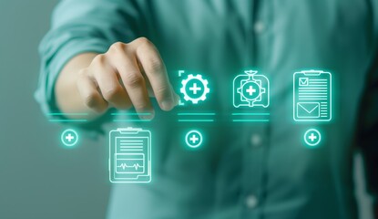 A person is pointing at a green screen with a medical symbol on it