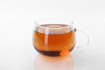 Tasty tea in cup on white background