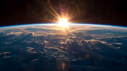 The sun rising over the curved horizon of Earth, as viewed from the stratosphere, highlighting the thin blue line of the atmosphere