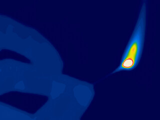 Burning match in hand. Image from thermal imager device.