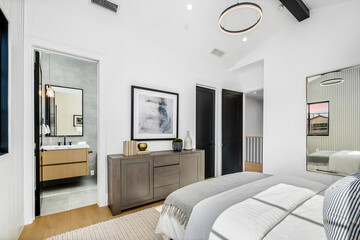 Bedroom With Bed, Dresser, and Mirror