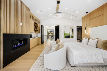 Bedroom With Fireplace and Large Bed