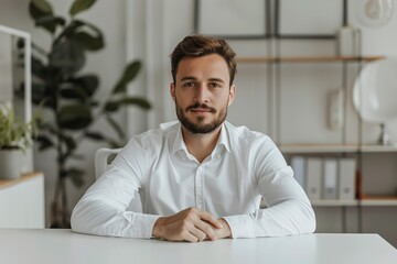 Portrait of psychotherapist at white table in office
