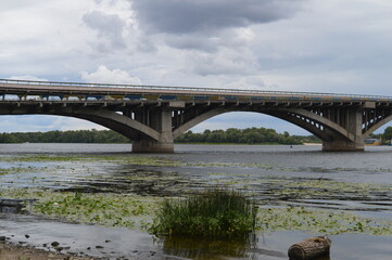 Obraz premium The southern bridge of Kyiv across the Dnipro river - river panorama