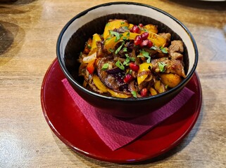 Delicious Georgian dish of fried vegetables with meat in bowl for lunch