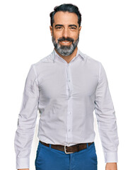 Middle aged man with beard wearing casual white shirt looking positive and happy standing and smiling with a confident smile showing teeth