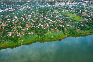 Aerial view of poor neighborhoods at the Paraguayan city of Ciudad del Este in the riverbank of the...